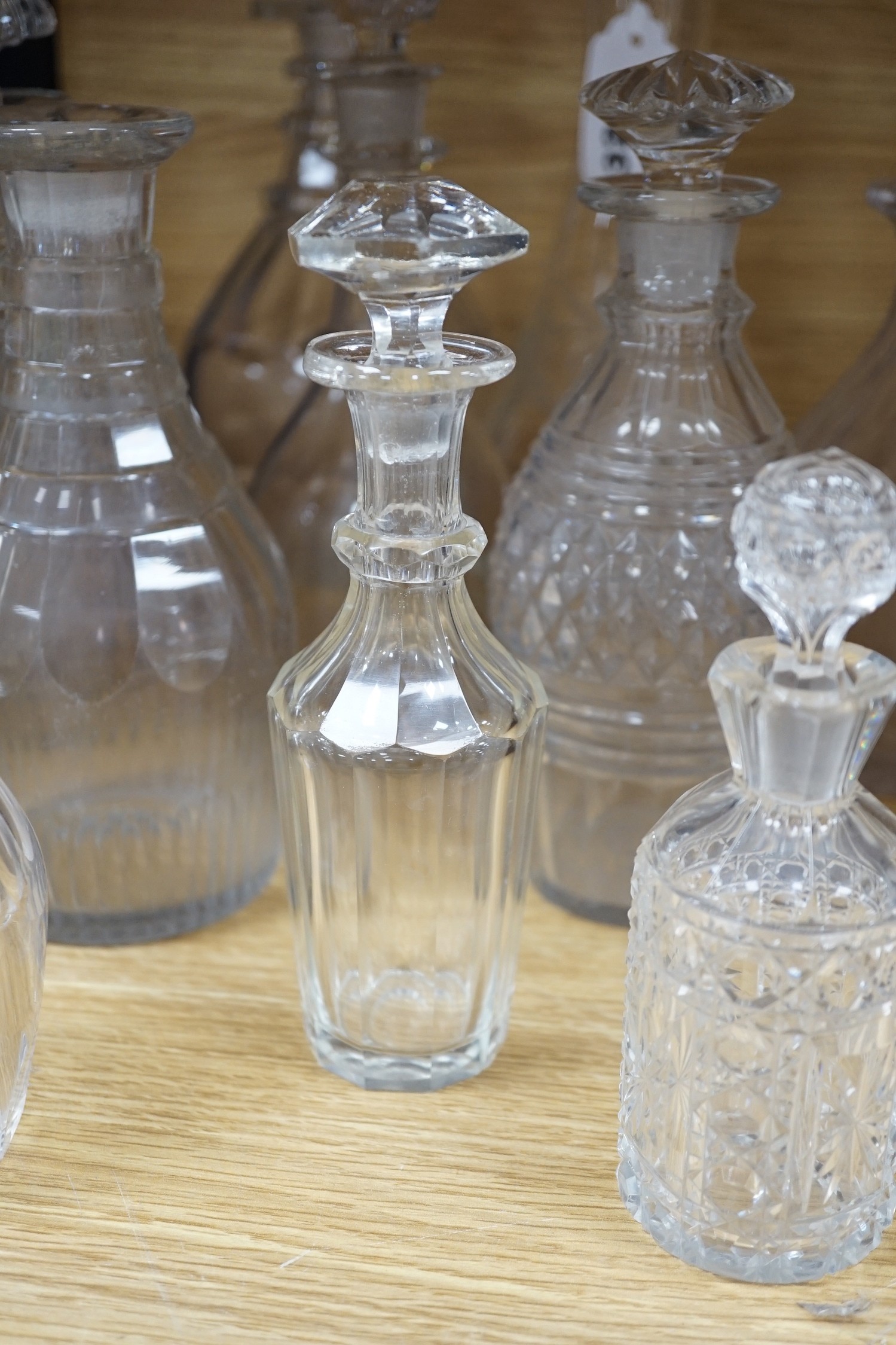 Twelve glass decanters and a carafe (13)